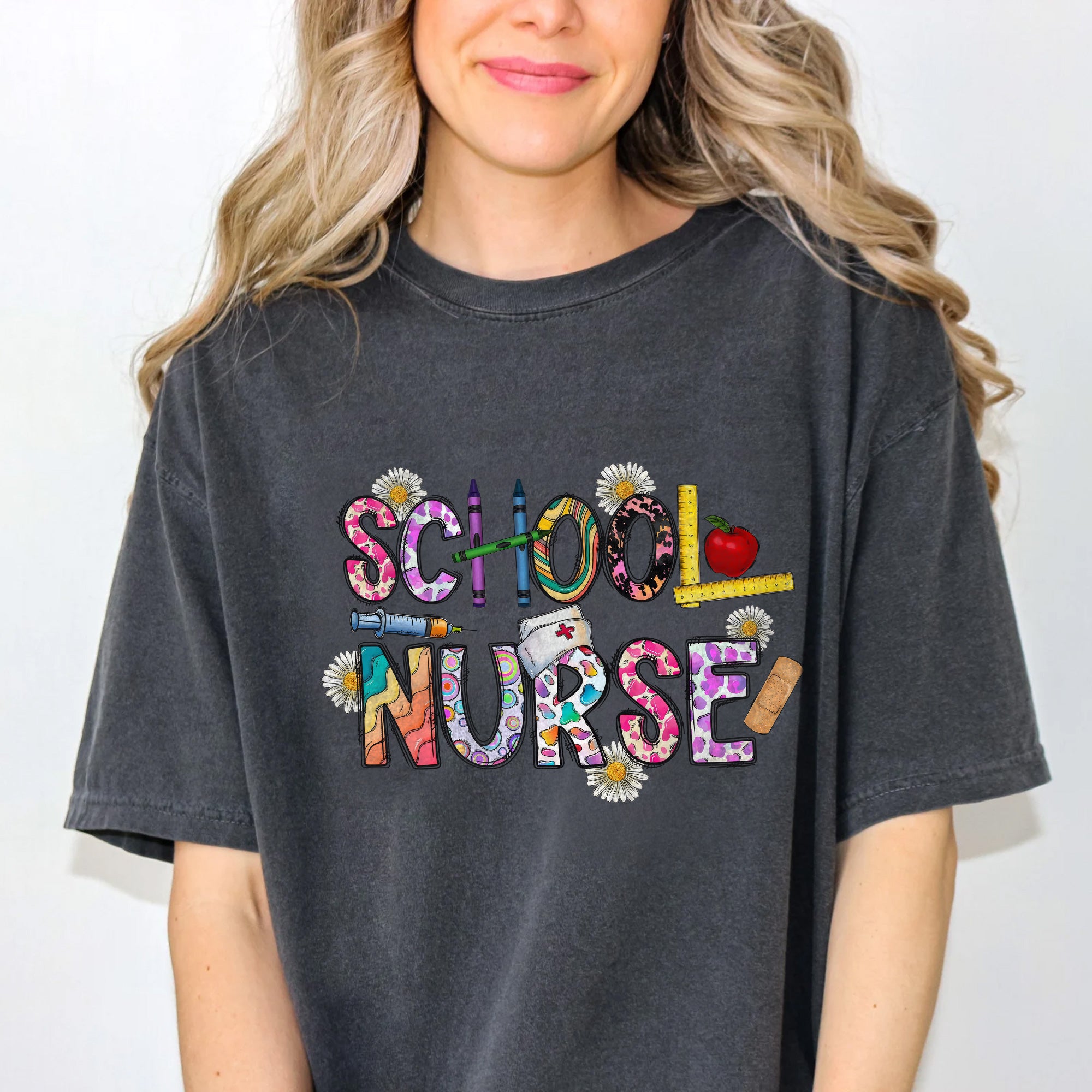 Cute School Nurse T-Shirt for Women – Colorful Letter Design with Crayons & Bandages – Fun Nurse Gift for Back to School
