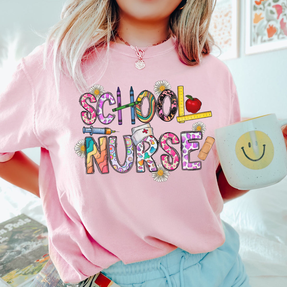 Cute School Nurse T-Shirt for Women – Colorful Letter Design with Crayons & Bandages – Fun Nurse Gift for Back to School
